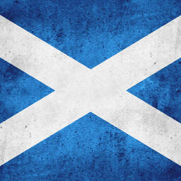 A circular picture of an artistic rendering of the Scottish flag